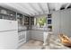 Functional kitchen featuring white appliances, ample cabinet space and butcher block countertop at 11170 Sw 190Th Ave, Dunnellon, FL 34432