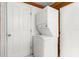 Functional laundry area with stacked washer and dryer units, maximizing space efficiency at 11170 Sw 190Th Ave, Dunnellon, FL 34432