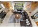 Inviting living room with a sectional sofa, fireplace, and large windows offering natural light at 11170 Sw 190Th Ave, Dunnellon, FL 34432