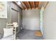 Entry mud room area with neutral decor, a chair, and natural light from the exterior door at 11170 Sw 190Th Ave, Dunnellon, FL 34432