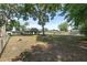 Expansive fenced backyard with mature trees, offering shade and privacy at 1601 Ne 47Th Ct, Ocala, FL 34470