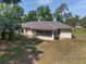 Aerial view of the home's backyard with a screened in patio at 1601 Ne 47Th Ct, Ocala, FL 34470