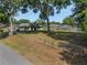 Large backyard with mature trees, privacy fencing, and a well-maintained lawn at 1601 Ne 47Th Ct, Ocala, FL 34470