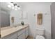Well-lit bathroom with a shower/tub combo, vanity, and neutral color scheme at 1601 Ne 47Th Ct, Ocala, FL 34470