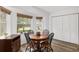 Inviting dining room with a wooden table, wood floors, and ample natural light at 1601 Ne 47Th Ct, Ocala, FL 34470