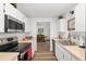 Well-lit kitchen with stainless steel appliances, tile floors, and white cabinetry at 1601 Ne 47Th Ct, Ocala, FL 34470