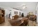 Open-concept living area with wood-look flooring, dining area, and sight lines to the kitchen at 1601 Ne 47Th Ct, Ocala, FL 34470