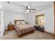 Spacious main bedroom features a ceiling fan and a large window with natural light at 1601 Ne 47Th Ct, Ocala, FL 34470