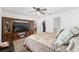 Comfortable bedroom featuring a ceiling fan, a large TV and ample space at 1601 Ne 47Th Ct, Ocala, FL 34470