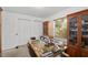 Office with a wooden desk and shelving, offering ample storage space, and a window at 1601 Ne 47Th Ct, Ocala, FL 34470