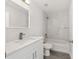 Bright bathroom featuring a shower-tub combo, vanity, and light gray flooring at 16697 Sw 30 Avenue Rd, Ocala, FL 34473