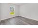 Cozy bedroom features light gray floors, natural light, and neutral paint at 16697 Sw 30 Avenue Rd, Ocala, FL 34473