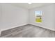 Well-lit bedroom with modern light gray flooring and a view of the neighborhood at 16697 Sw 30 Avenue Rd, Ocala, FL 34473