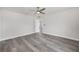 Spacious bedroom with light gray flooring, ceiling fan, and white trim offering a bright, airy feel at 16697 Sw 30 Avenue Rd, Ocala, FL 34473