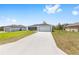 Contemporary one-story home with a long driveway and attached two-car garage at 16697 Sw 30 Avenue Rd, Ocala, FL 34473