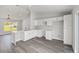 Well-lit kitchen with white cabinets, granite countertop, and stainless steel faucet at 16697 Sw 30 Avenue Rd, Ocala, FL 34473