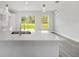 Bright kitchen featuring quartz countertops and stainless steel faucet at 16697 Sw 30 Avenue Rd, Ocala, FL 34473