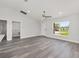 Inviting living room featuring wood-look floors, a modern ceiling fan, and recessed lighting at 16697 Sw 30 Avenue Rd, Ocala, FL 34473