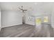 Spacious open-concept living area with stylish pendant lighting and gray vinyl floors at 16697 Sw 30 Avenue Rd, Ocala, FL 34473