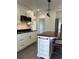 Modern white kitchen with stainless steel appliances and a kitchen island at 1705 Nw 18Th Ave, Ocala, FL 34475