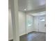 Bright living room with grey vinyl floors, white walls, and natural light at 1705 Nw 18Th Ave, Ocala, FL 34475