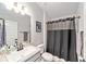 Bathroom featuring a shower with curtain, vanity with sink and mirror at 181 Nw 45Th Loop, Ocala, FL 34475