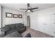 Bedroom with a sofa, fan, carpeted floor, and closet for storage at 181 Nw 45Th Loop, Ocala, FL 34475