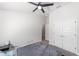 Cozy bedroom featuring a ceiling fan, carpeted floor, and closet for storage at 181 Nw 45Th Loop, Ocala, FL 34475