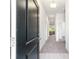 Inviting entryway featuring a long hallway with neutral walls and plush carpet, illuminated by modern recessed lighting at 181 Nw 45Th Loop, Ocala, FL 34475
