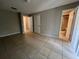 Spacious bedroom with tile flooring, closet, and ensuite bathroom access at 1910 Sw 34Th Ct, Ocala, FL 34474