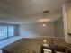 Kitchen island with granite countertops and a view of the open floor plan at 1910 Sw 34Th Ct, Ocala, FL 34474