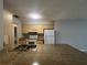 Kitchen with granite countertops and plenty of cabinet space, next to the dining and living area at 1910 Sw 34Th Ct, Ocala, FL 34474