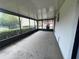 Enclosed patio with screen and concrete floor at 1910 Sw 34Th Ct, Ocala, FL 34474