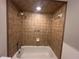 Updated shower with neutral tile surround, designer accents, and updated fixtures at 1910 Sw 34Th Ct, Ocala, FL 34474