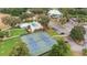 Aerial view of the community tennis courts, pool, and clubhouse amenities at 19586 Sw 84Th Pl, Dunnellon, FL 34432
