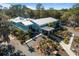 Aerial view of community building with palm tree lined entrance at 19586 Sw 84Th Pl, Dunnellon, FL 34432