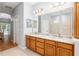 Spacious bathroom with a large vanity, double sinks, walk-in shower, and a soaking tub at 19586 Sw 84Th Pl, Dunnellon, FL 34432
