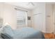 Bright bedroom featuring a comfortable bed, window, and closet space, creating a cozy and inviting atmosphere at 19586 Sw 84Th Pl, Dunnellon, FL 34432