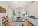 Dining room with a chandelier, abundant natural light, and elegant decor at 19586 Sw 84Th Pl, Dunnellon, FL 34432
