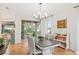 Dining room showcasing elegant chandelier and access to the outdoors at 19586 Sw 84Th Pl, Dunnellon, FL 34432
