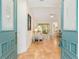 Inviting entryway with decorative blue doors opens to a spacious living area featuring tile floors at 19586 Sw 84Th Pl, Dunnellon, FL 34432