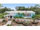 Charming exterior of community building with well-maintained landscaping and inviting entrance at 19586 Sw 84Th Pl, Dunnellon, FL 34432