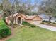 Charming home with a well-manicured lawn and inviting landscaping, creating a welcoming curb appeal at 19586 Sw 84Th Pl, Dunnellon, FL 34432