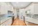 Galley kitchen with ample cabinet space, stainless steel appliances, and a walk-in pantry at 19586 Sw 84Th Pl, Dunnellon, FL 34432
