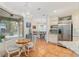 Bright eat-in kitchen features stainless steel appliances and a charming breakfast nook with views of nature at 19586 Sw 84Th Pl, Dunnellon, FL 34432