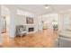 Bright living room featuring a fireplace, tile floors, open concept and comfortable seating at 19586 Sw 84Th Pl, Dunnellon, FL 34432