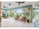 Relaxing screened-in porch with comfortable seating and scenic views, perfect for enjoying the outdoors in comfort at 19586 Sw 84Th Pl, Dunnellon, FL 34432