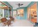 Inviting screened lanai offering ample space and views of the kitchen and dining area at 19586 Sw 84Th Pl, Dunnellon, FL 34432