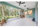 Large screened lanai featuring a view of the outdoor landscape, dining area and offering ample space for leisure at 19586 Sw 84Th Pl, Dunnellon, FL 34432