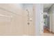 Tiled shower with adjustable shower head and neutral tones, ready for your personal touch at 19586 Sw 84Th Pl, Dunnellon, FL 34432